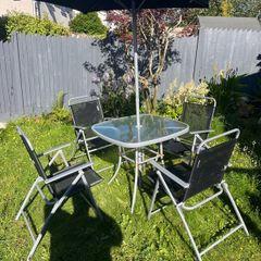 Outdoor table and folding chairs