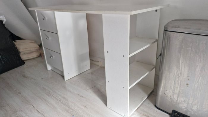 White desk with three drawers and side shelving