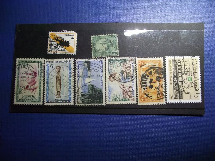 The collection of old stamps from French colonies on stock cards