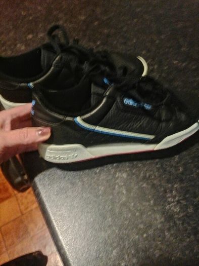 beautiful black leather Adidas runners