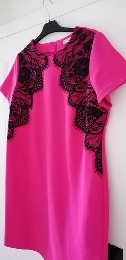 Dress size 18 deep pink with black lace detailing zip opening at back
