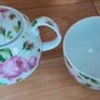 Tea for one: tea pot and cup with rose design on white Image 5