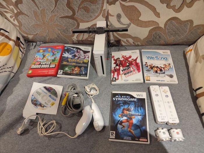 Wii Bundle with Pokemon, Mario Bros, Sports and Sports Resorts