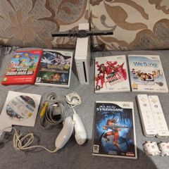 Wii Bundle with Pokemon, Mario Bros, Sports and Sports Resorts