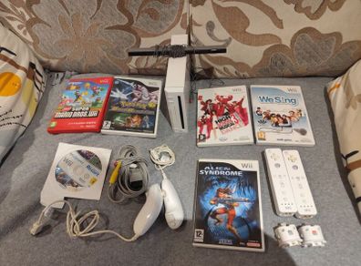 Wii Bundle with Pokemon, Mario Bros, Sports and Sports Resorts
