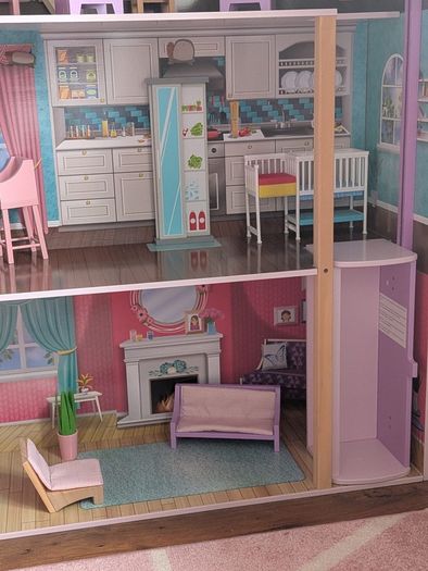 Large wooden dolls house with furniture