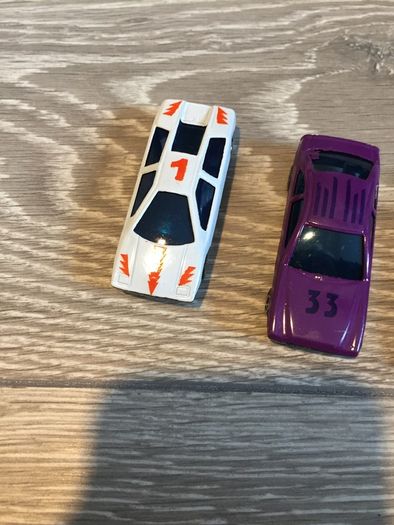 Four plastic Toy Cars