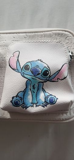 Stitch crossbody bag with matching purse.