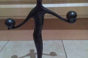 bronze figure on stand