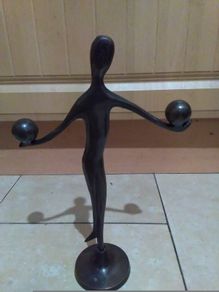 bronze figure on stand