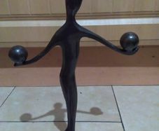 bronze figure on stand