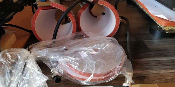Heat press machine with mug and hat attachments