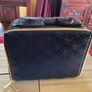 Estee Lauder Vanity case in black with applique style design in the front and a nice bow style handle on top Image 6