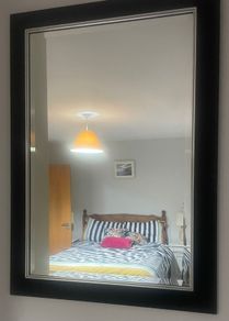 black wooden framed wall mirror with silver insert
