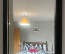 black wooden framed wall mirror with silver insert