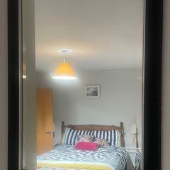 black wooden framed wall mirror with silver insert