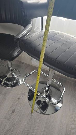 Adjustable black faux leather swivel bar stool with a metal base x3