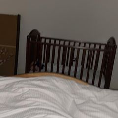 Baby cot, dark wood finish