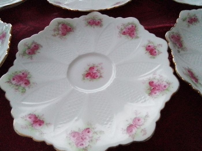 Six Pretty China Saucers