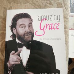 Amuzing Grace. The Official Autobiography.  By Brendan Grace With Tara King. Signed First Edition Paperback In Good Condition.  See Photos For Same.