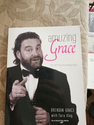 Amuzing Grace. The Official Autobiography.  By Brendan Grace With Tara King. Signed First Edition Paperback In Good Condition.  See Photos For Same.