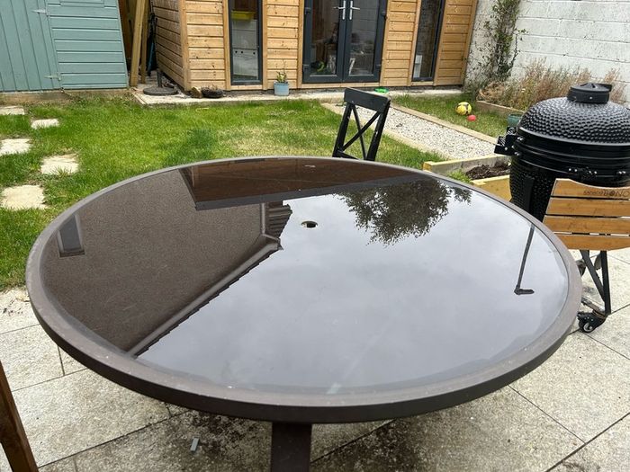 Round glass top garden table