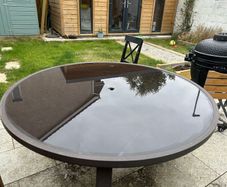 Round glass top garden table