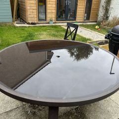Round glass top garden table