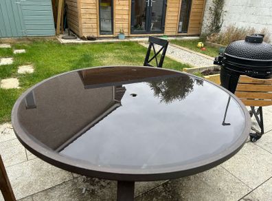 Round glass top garden table