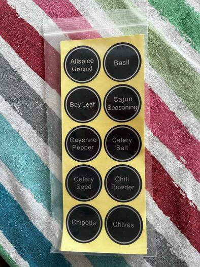 24 spice jars with labels