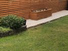 Custom timber garden fencing with integrated planters and bench Image 8
