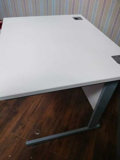 Modern white office desk with grey metal frame