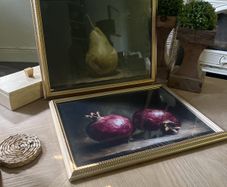 Two gold framed fruit prints.