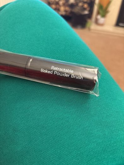 Retractable baked powder brush