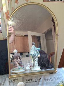 Beautiful Late 20th century Arched Brass Colored Metal Wall Mirror, the arched plate within tubular uprights with spherical finials. Collection is Preferred