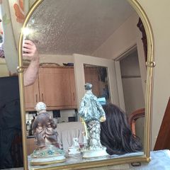 Beautiful Late 20th century Arched Brass Colored Metal Wall Mirror, the arched plate within tubular uprights with spherical finials. Postage Available or Collection is Preferred