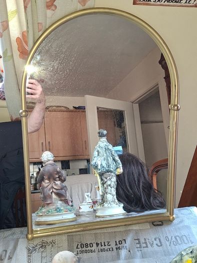 Beautiful Late 20th century Arched Brass Colored Metal Wall Mirror, the arched plate within tubular uprights with spherical finials. Collection is Preferred