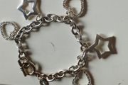 A fashionable bracelet with silver-tone charms.