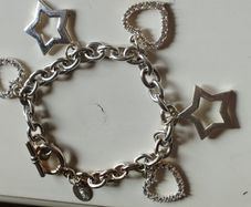 A fashionable bracelet with silver-tone charms.