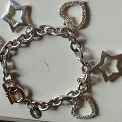 A fashionable bracelet with silver-tone charms.