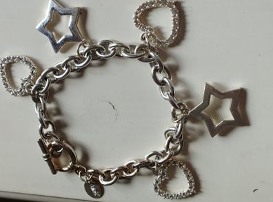 A fashionable bracelet with silver-tone charms.