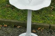 Old bird feeder with bird