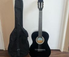 Child's 3/4 Guitar with Carrier, Extra Strings, Strap and 3 Picks.