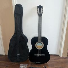 Child's 3/4 Guitar with Carrier, Extra Strings, Strap and 3 Picks.