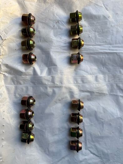 Four Black Steel Wheel Rims and Sixteen bolts
