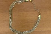 Multi chain gold tone necklace