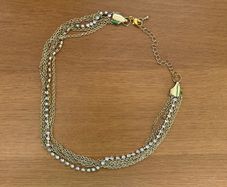 Multi chain gold tone necklace