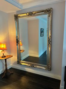Large ornate wood/gold-effect wall mirror