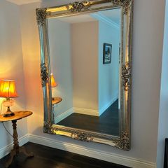 Large ornate wood/gold-effect wall mirror