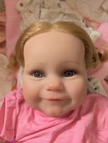 Lifelike baby girl reborn doll.
